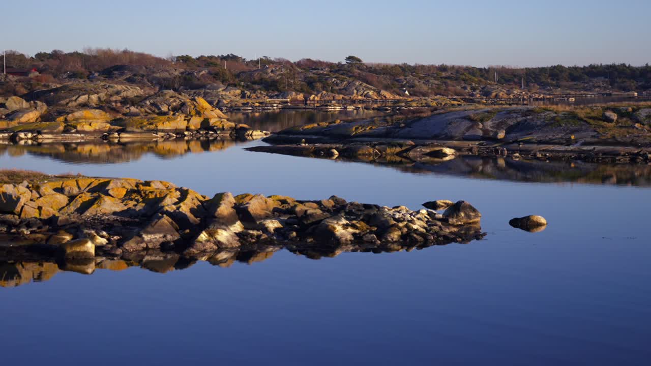 Sandefjord coastal waterfront seaside town tower marina Strömstad Stromstad Sweden Sverige coastline OsloFjord Nakholmen Island inner Scandaniva sunset golden hour yacht ferry boat pan left motion