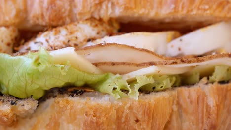 close-up of a croissant sandwich