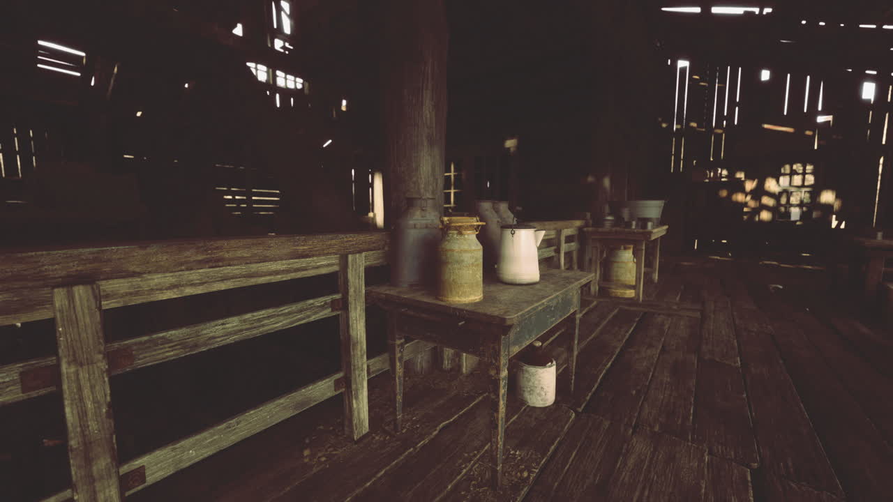 Rustic interior of an old barn showcasing vintage jars and wooden tables
