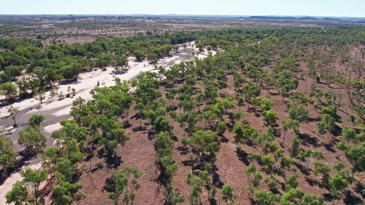 Aerial footage along the banks of the Finke River near the Stuart Highway in the Northern Territory, Australia. August 2022.