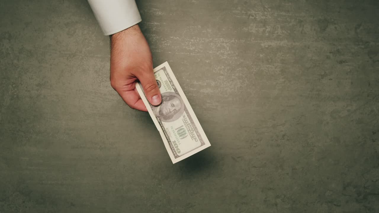 Specialised police officer Counting dollar banknotes in crime lab, conceptual image. High quality 4k footage