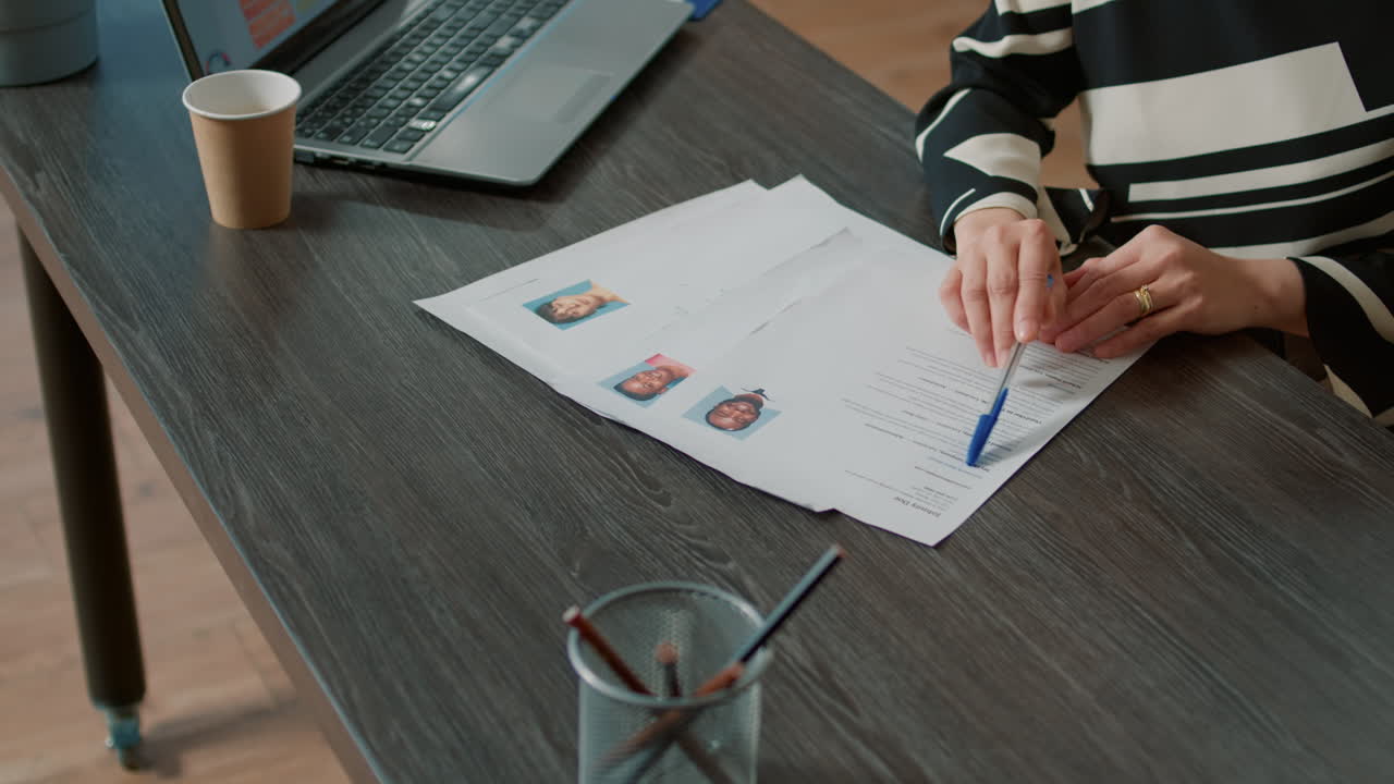 Office worker analyzing candidates cv and application form