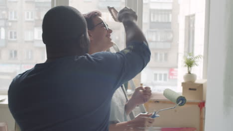 couple painting a room together