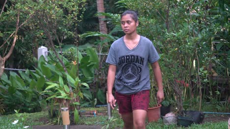 portrait of a young woman at the orphanage home in the philippines walking towards the camera