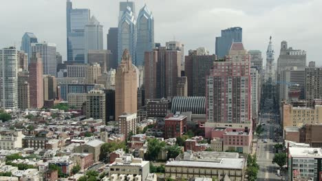 tight aerial tilt up reveals philadelphia skyline skyscrapers, downtown financial district, city hall, s broad st, city hall, summer day, establishing shot urban city in usa