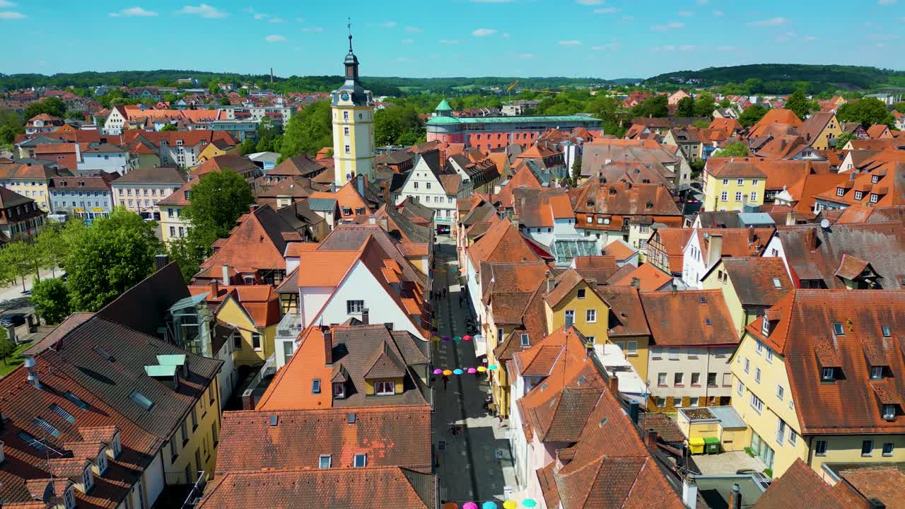 4K Aerial Drone Video of the Historic Herrieder Clock Tower in the Old Town area of Downtown Ansbach, Germany
