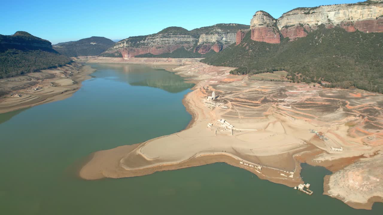 Sau swamp dike in Catalonia, Spain, intense drought in 2024 Drone flight in a beautiful natural park in Spain, Europe pantano de sau