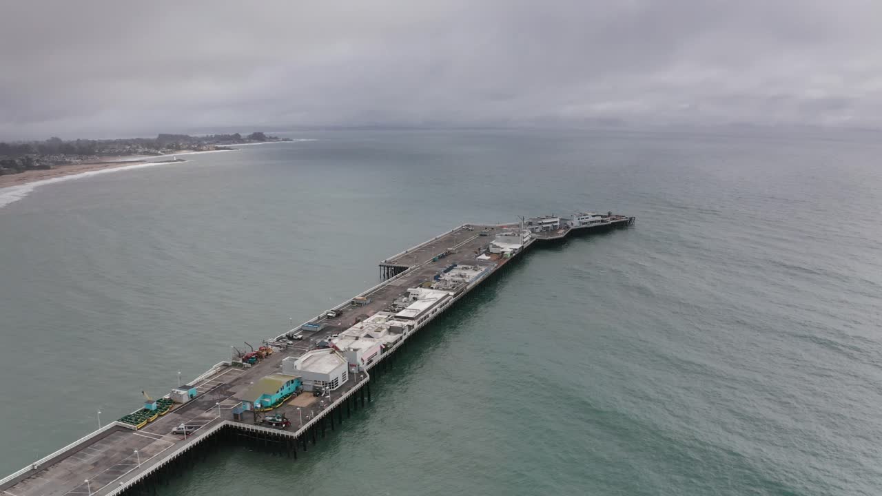 Wide panning aerial shot of the Santa Cruz Municipal Wharf after its partial collapse in Santa Cruz, California. 4K