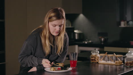 woman eating sushi at home