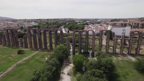 old roman half preserved water aqueduct in merida, spain, aerial sideways