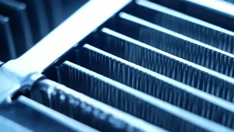 the close-up presentation showcases gleaming metal grill bars arranged neatly in a contemporary kitchen. the strong lines and gleam highlight craftsmanship and readiness for culinary use.