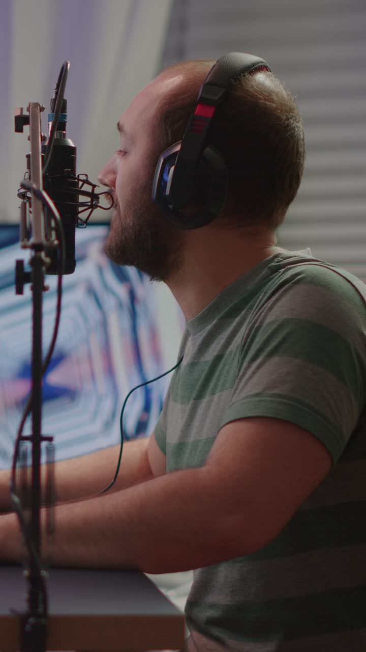 Man Streaming or Podcasting with Headphones and Microphone