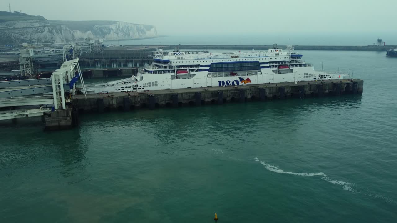 Ferry docked at port with coastal views