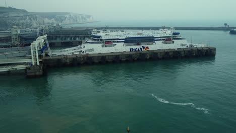 Ferry docked at port with coastal views