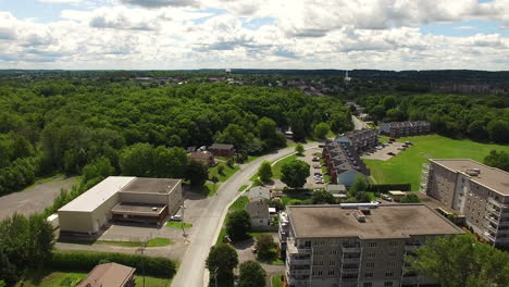 Aerial-tracking-shot-with-small-town-seen-in-the-distance