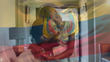 father and child embracing with ecuador flag animation overlay at home