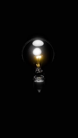 glowing light bulb on black background