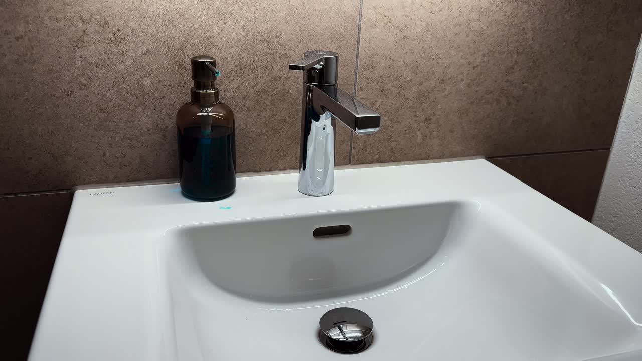 A stylish modern bathroom sink with clean design and minimal decor, symbolizing hygiene, renovation, and a fresh start in a new home