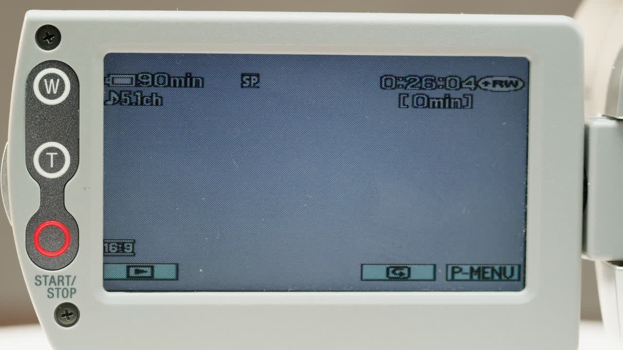 Old vintage video camera close-up. Popular retro camcorder shooting. Non disk on video-camera monitor.