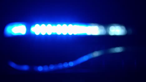 blurry police car lights in the night