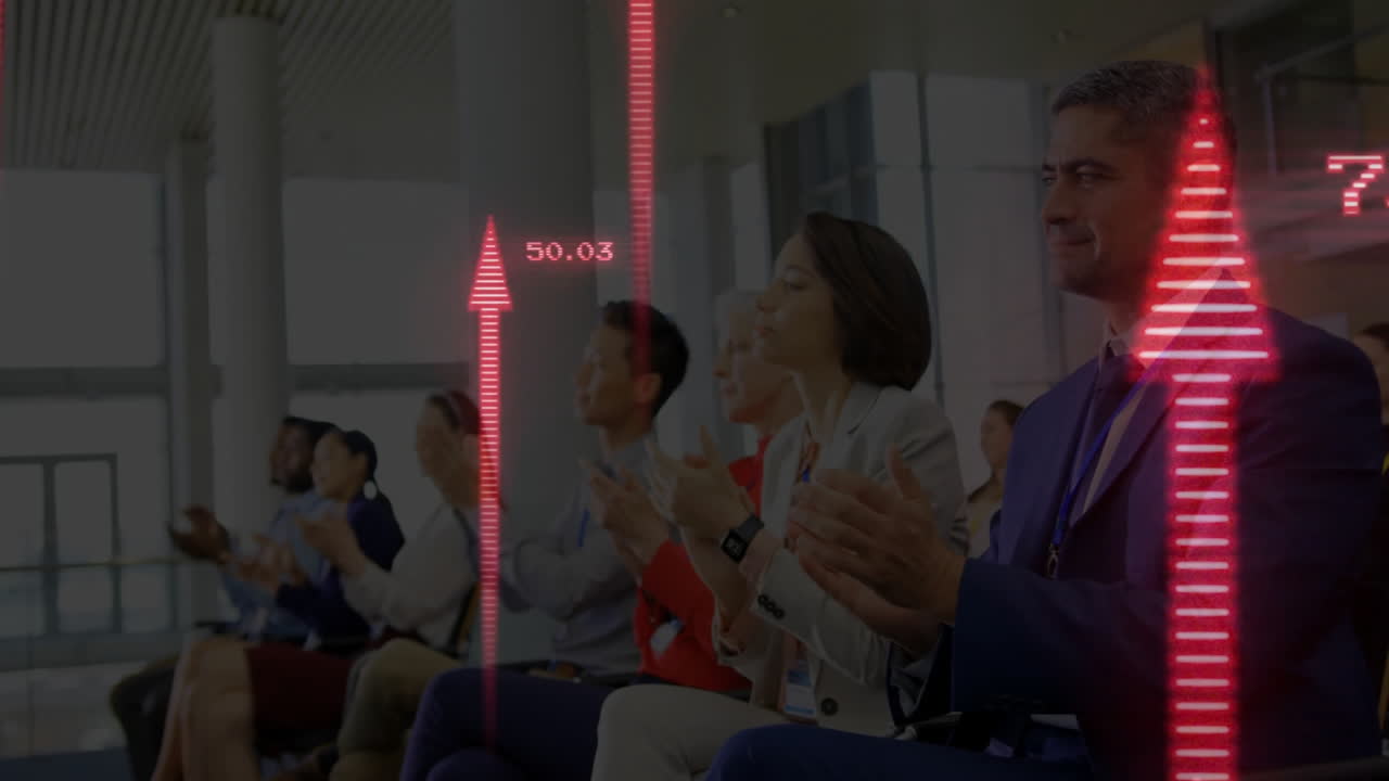 Business professionals clapping at conference, showing animated red arrows with numeric growth data
