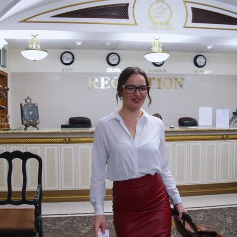 woman getting hotel key card