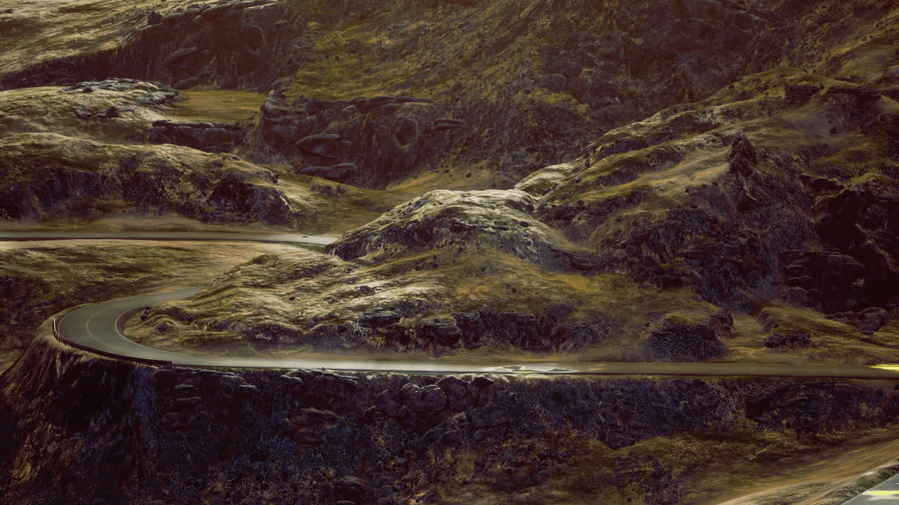 Winding road through rugged mountains under the golden glow of sunset