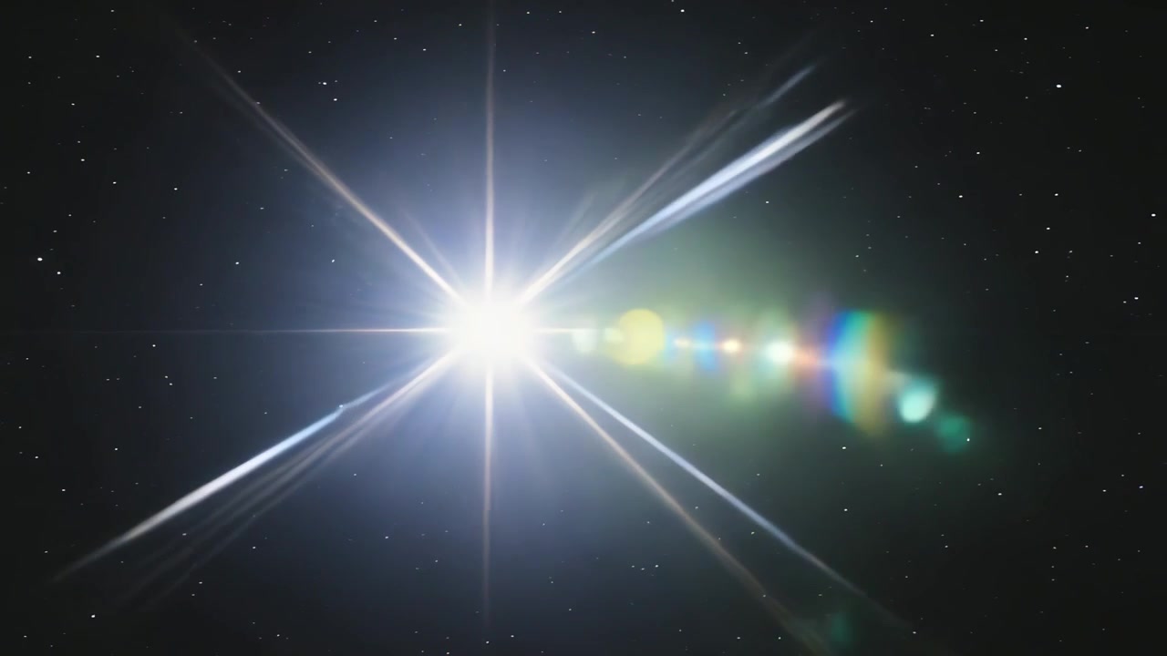 Punto luminoso simile a una stella che si muove attraverso un campo stellare, creando lunghe punte e sfere di bagliore colorate.