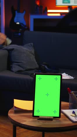 vertical video african american man browses mobile phone next to mockup copy space