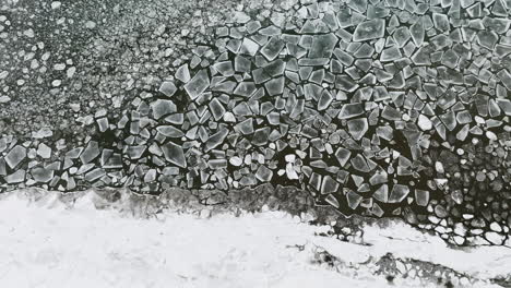 drone shot gliding over the serene stillness of lake michigan encased in ice