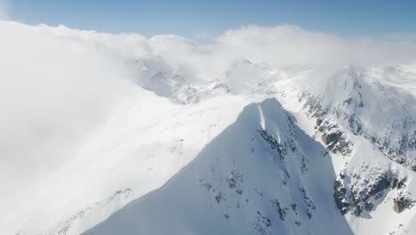 snowy mountain peaks aerial view