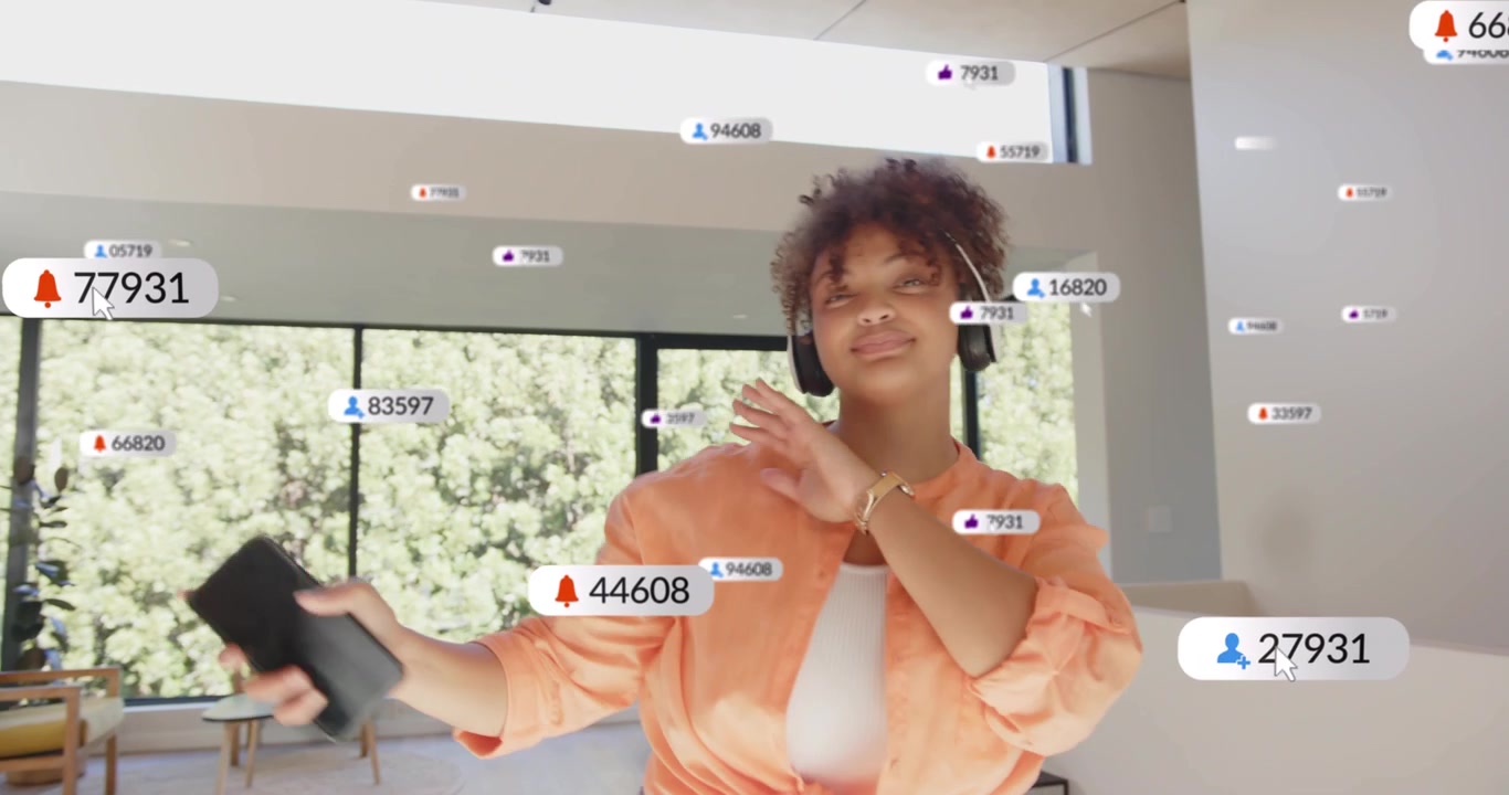 Streaming creator tapping phone and dancing in room, receiving growing alerts and engaging fans