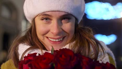 close up of woman holding a bunch of red roses/krakow/poland