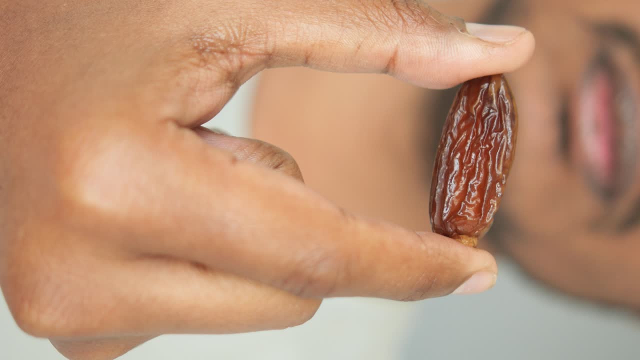 Person Holding a Date