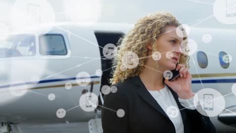 animation of network of connections over caucasian businesswoman talking on smartphone