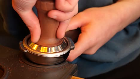 barista tamping espresso