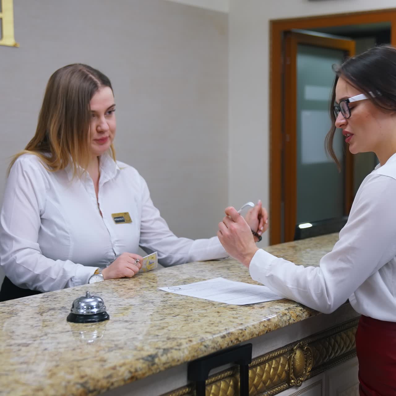 Woman at counter in hotel