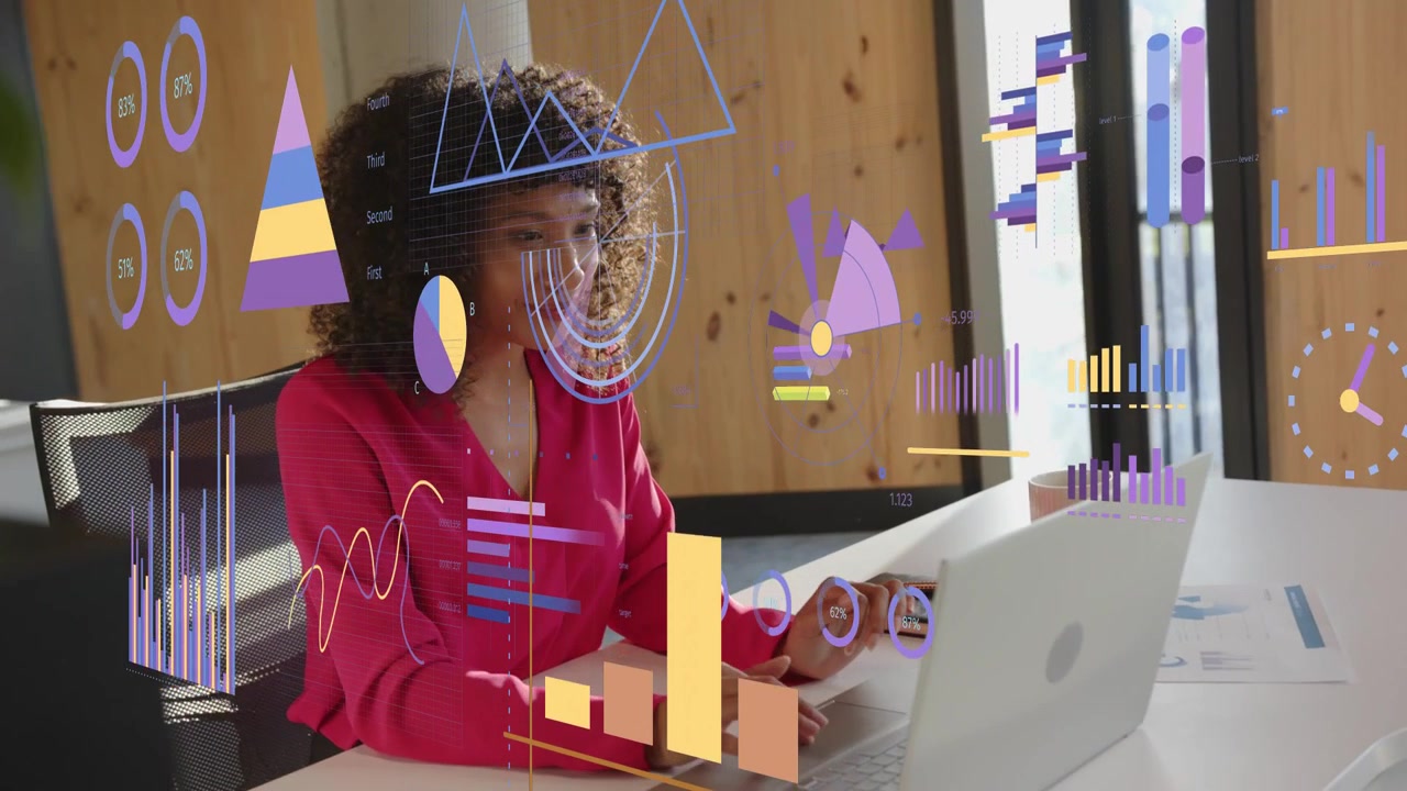 Woman analyzing data at laptop and reaching for report to review, animated charts over laptop