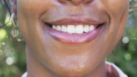 A-close-up-of-an-African-American-woman''s-smile-reveals-gleaming-white-teeth