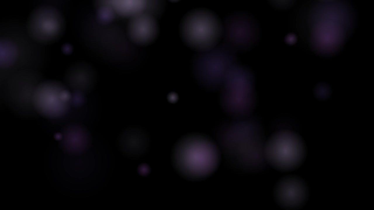 Abstract Purple Bokeh Light Particles Floating on Black Background