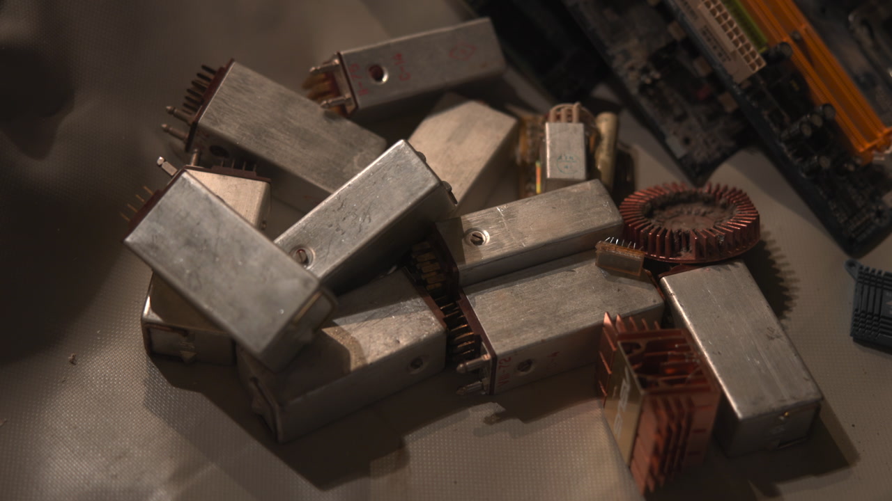 Pile Of Transformer Cores And Coils, Industrial Close View Highlighting Copper Windings, Metal Laminates . Media