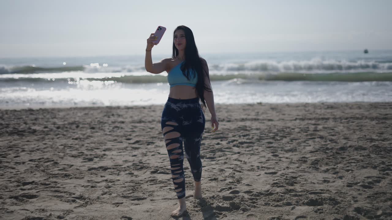 Woman taking a selfie on a beach