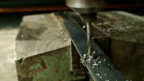 4k close up of metal drilling at home workshop