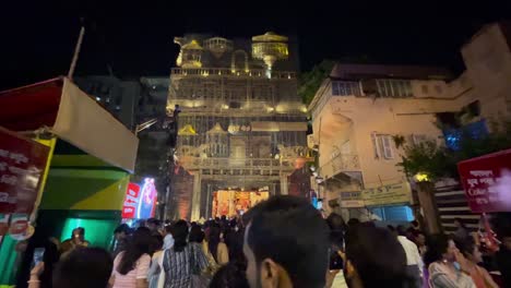 vibrant night festival in india: crowds gather at illuminated temple