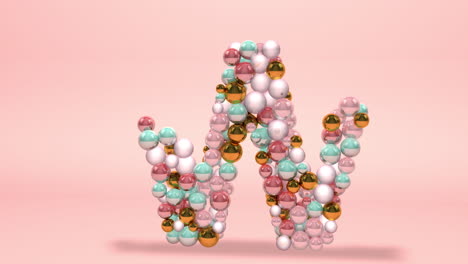 letra hecha de cuentas, bolas de vidrio, perlas pastel, joyas de cristal y oro