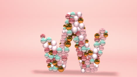 letter w made of beads, glass balls, pastel pearls, crystal jewels and gold