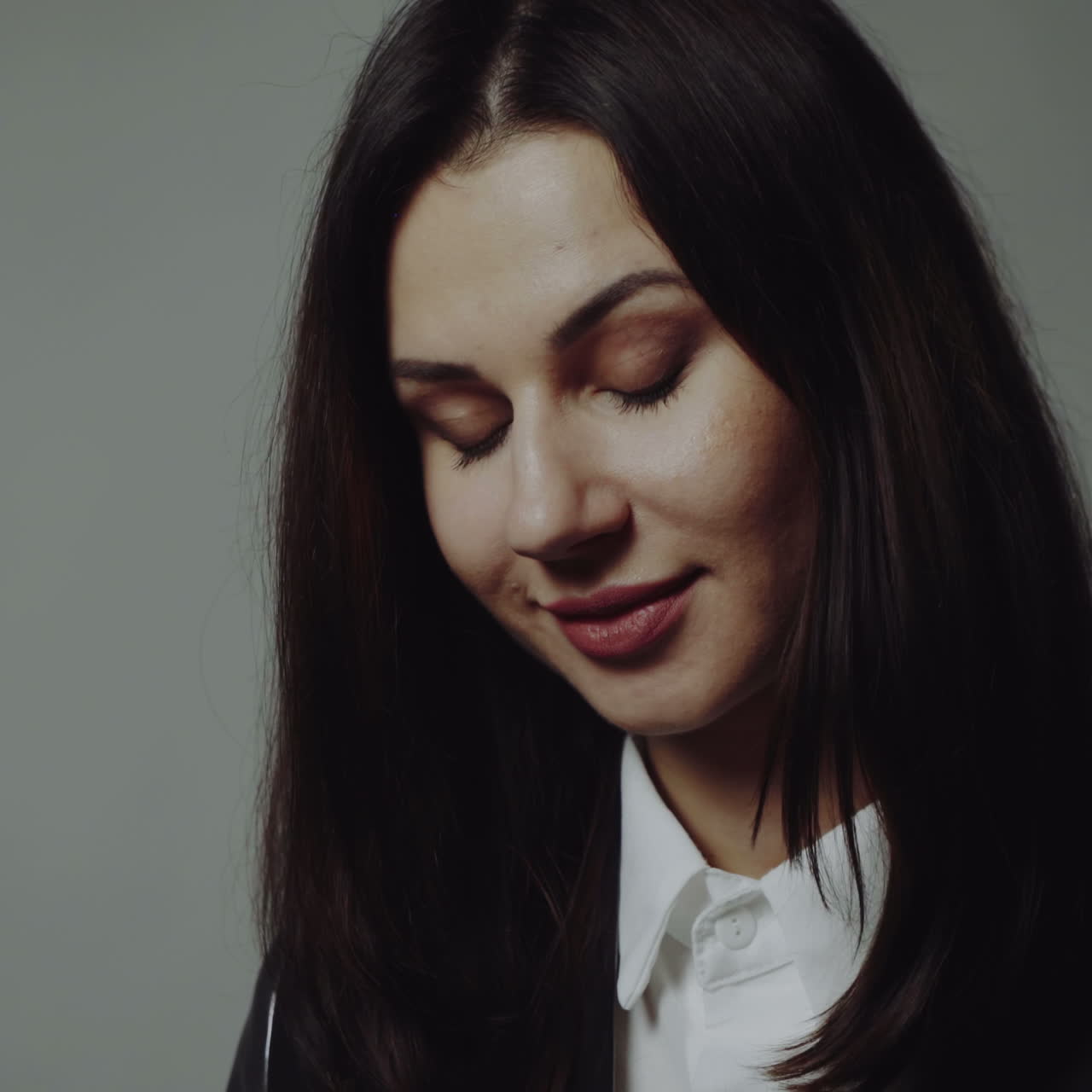 Portrait of a young beautiful brunette with a beautiful make up Square video