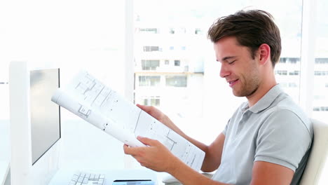 Architect-working-at-his-desk