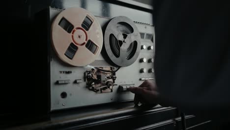 wiretapping on the reel tape recorder in secret room. special agent work. spying conversations. spy or intelligence gathering. espionage concept.