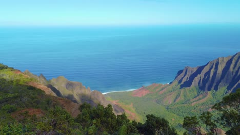 4K-Hawaii-Kauai-shot-of-a-beautiful-canyon-and-ocean-view-from-Pu'u-Kila-Lookout-with-pan-left-to-right-in-middle-of-clip